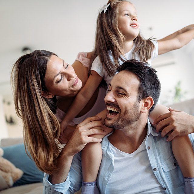 Happy young family in new property